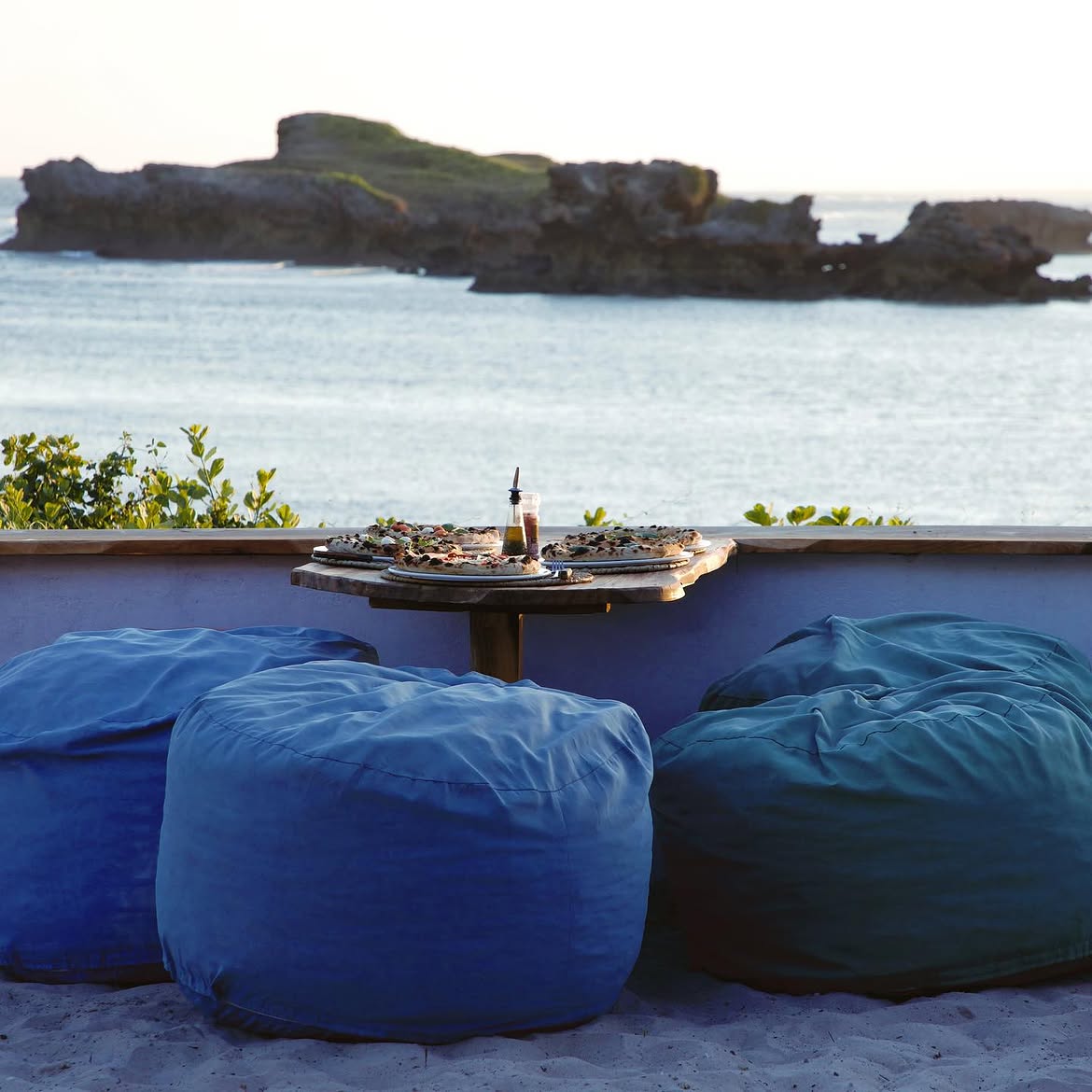 Pizza and beanbags overlooking the sea at Sunset Lab Watamu